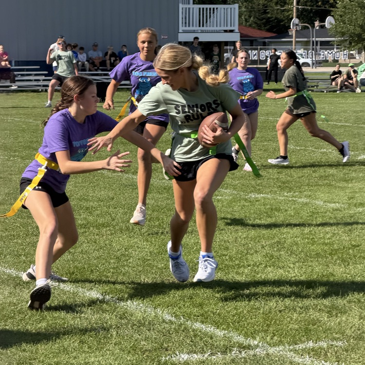 students playing football
