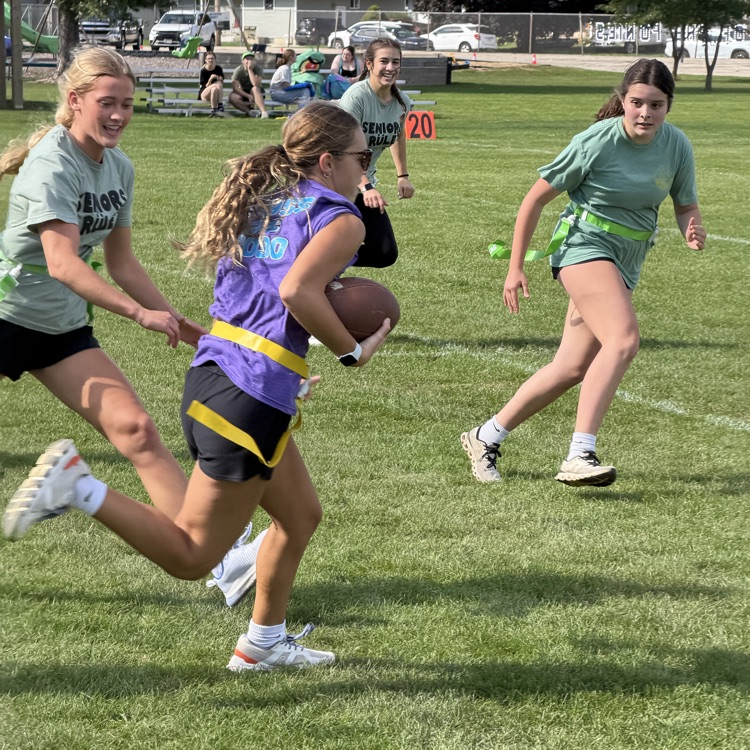 students playing football