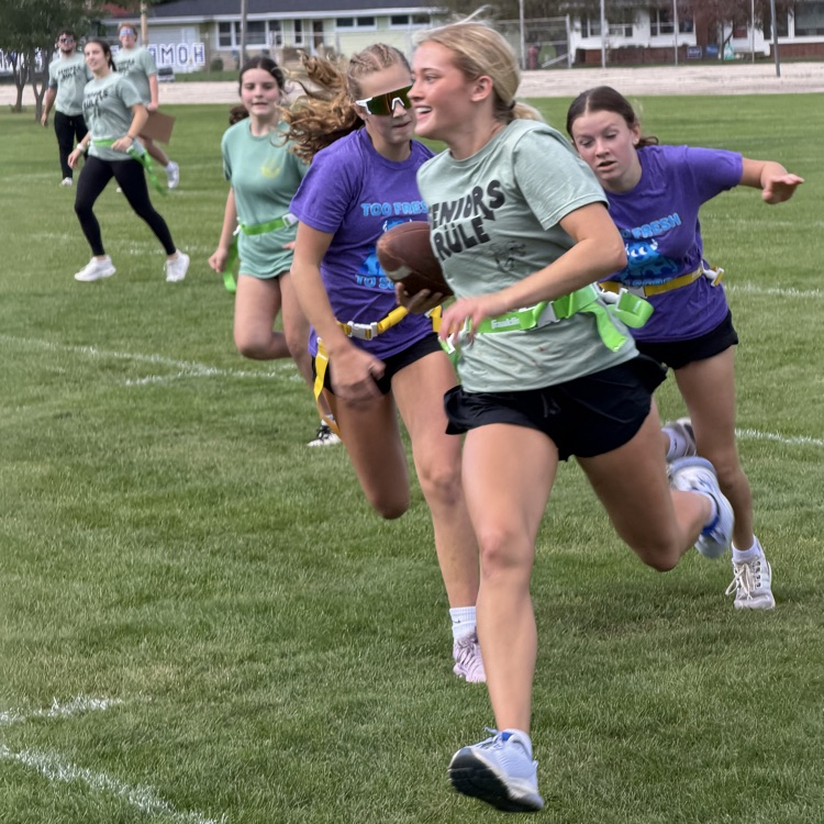students playing football