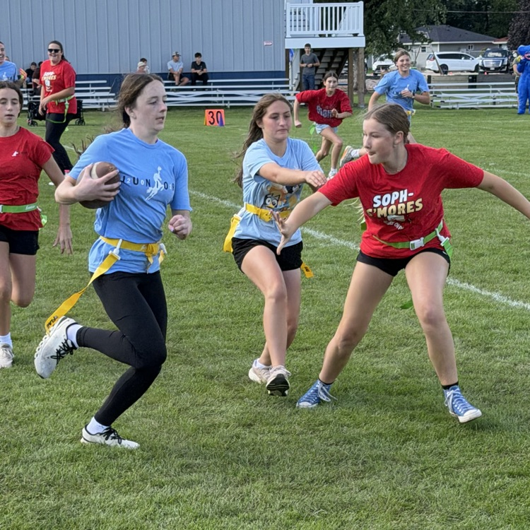 students playing football