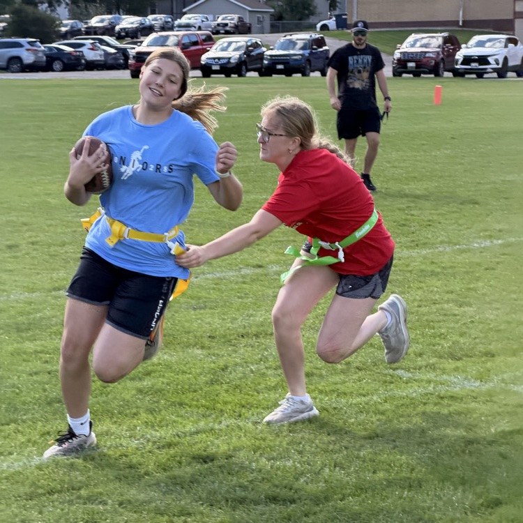 students playing football