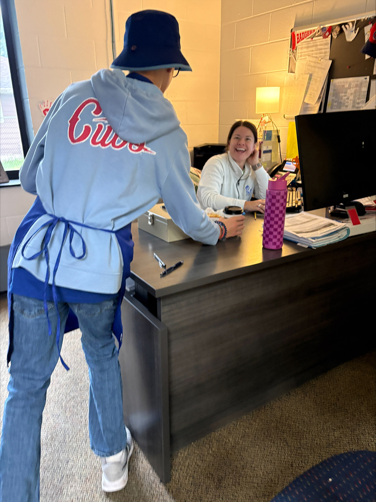 Student delivering coffee to school staff