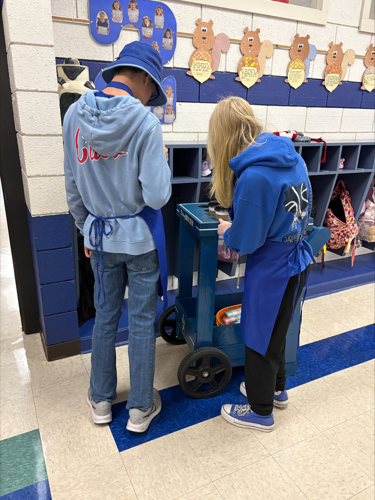 Two students with a coffee cart