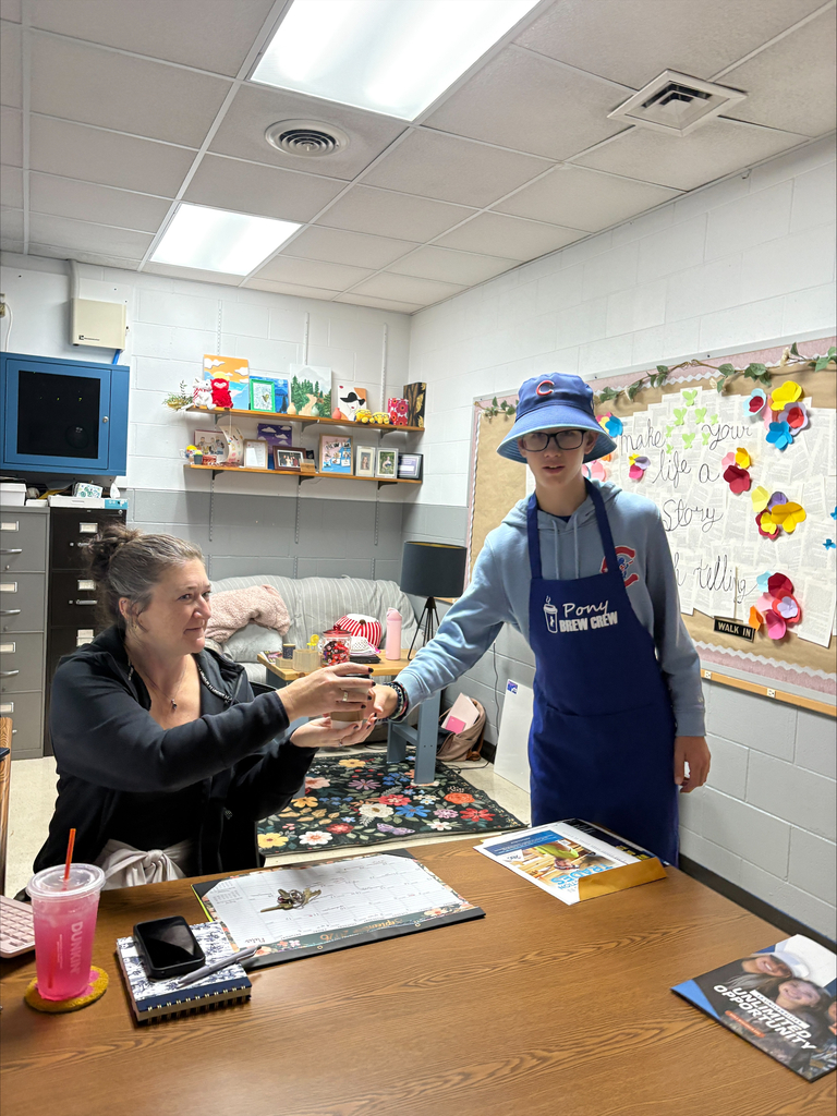 Student delivering coffee to school advisor