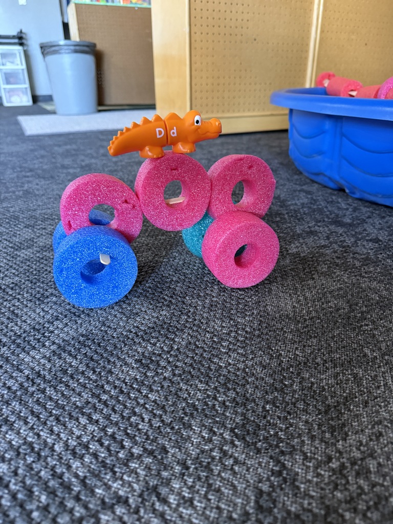 Creative Car with pool noodles and dinosaur toy