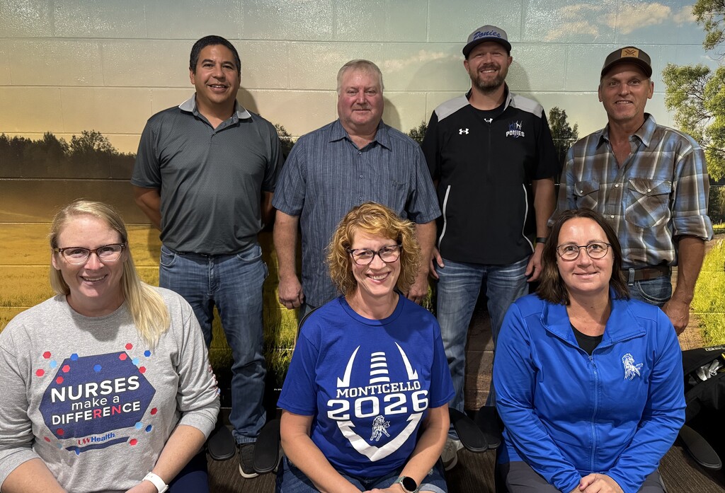 Seven School Board Members Smiling