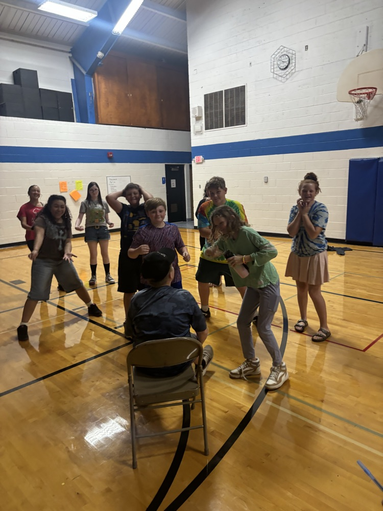 Students playing charades. 