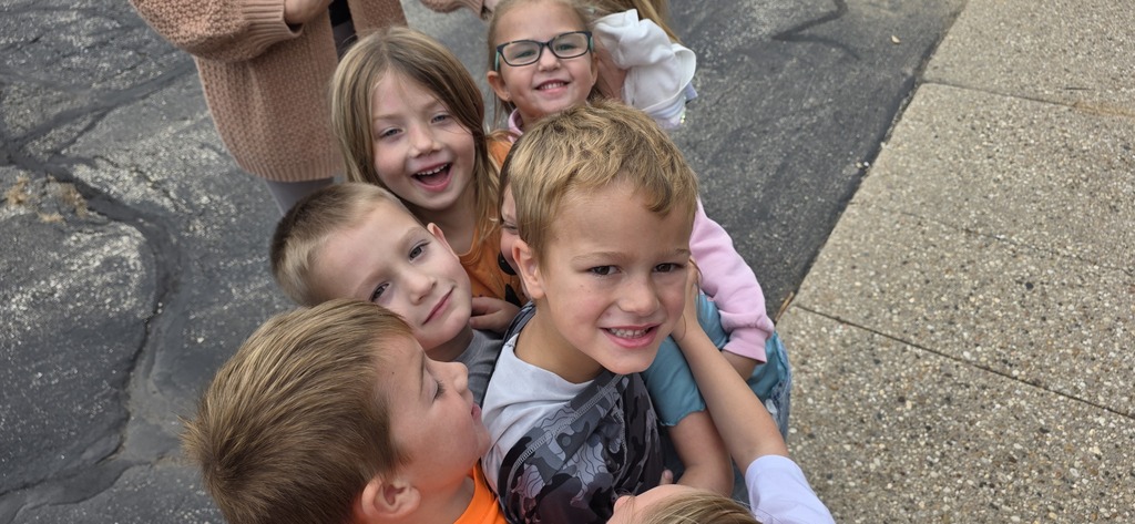 Group hug with children.