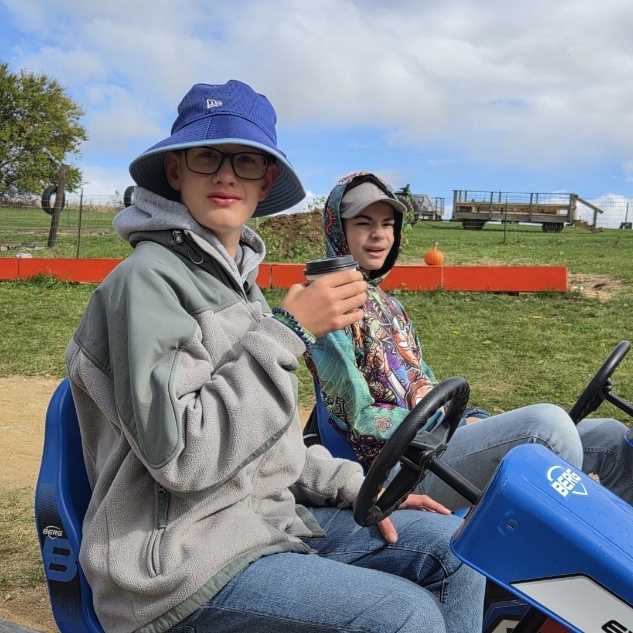 Two students on a go kart.
