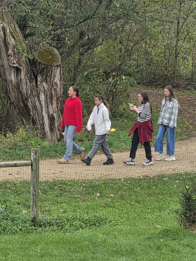 Girls walking on a trail.