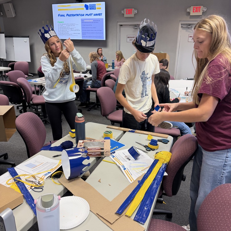 FBLA students with duct tape, creating prototypes at Mini-Business World.