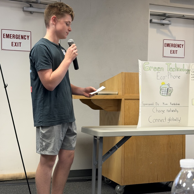 FBLA student presenting his project on an eco-phone.