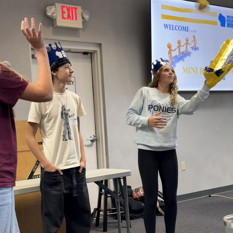 FBLA students presenting their mega mitt project.