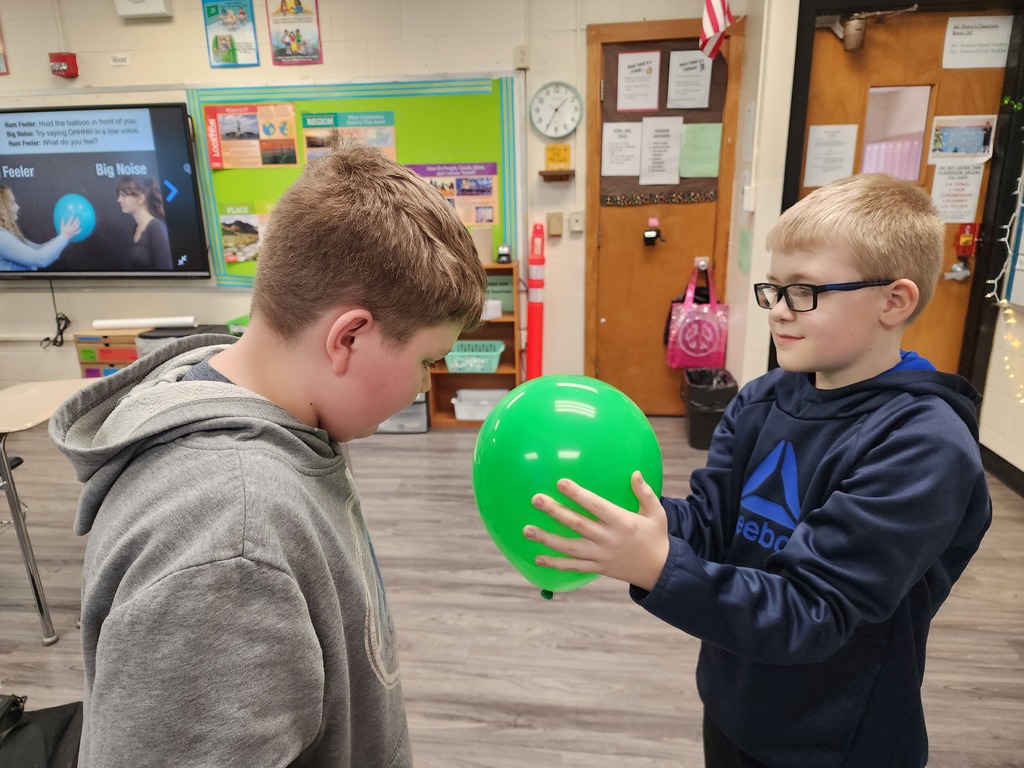 Students are exploring sound vibrations.