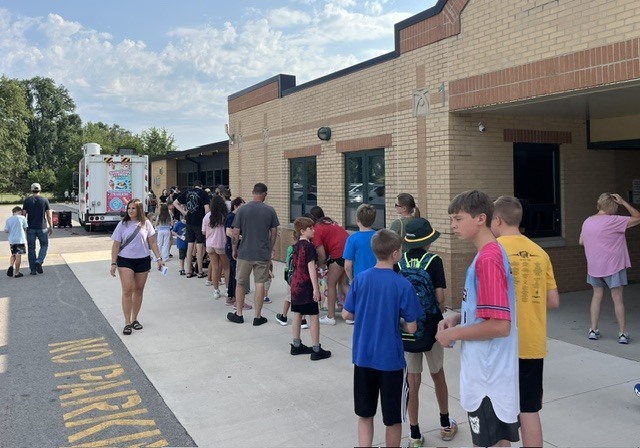 The line of students waiting for Sundae Funday! So many yummy flavors to choose from.