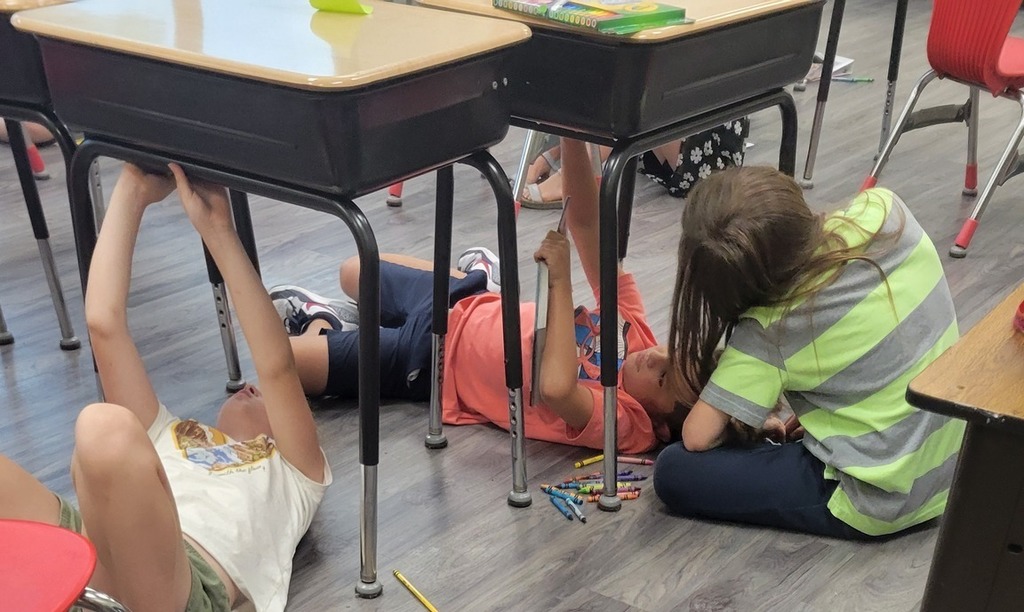 students under desks