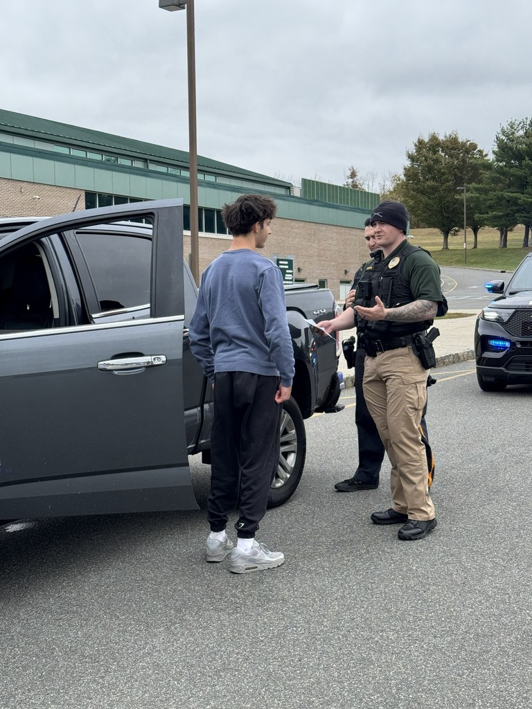 Officer Palma and Detective Johnson model traffic-stops for students in the Criminology classes.