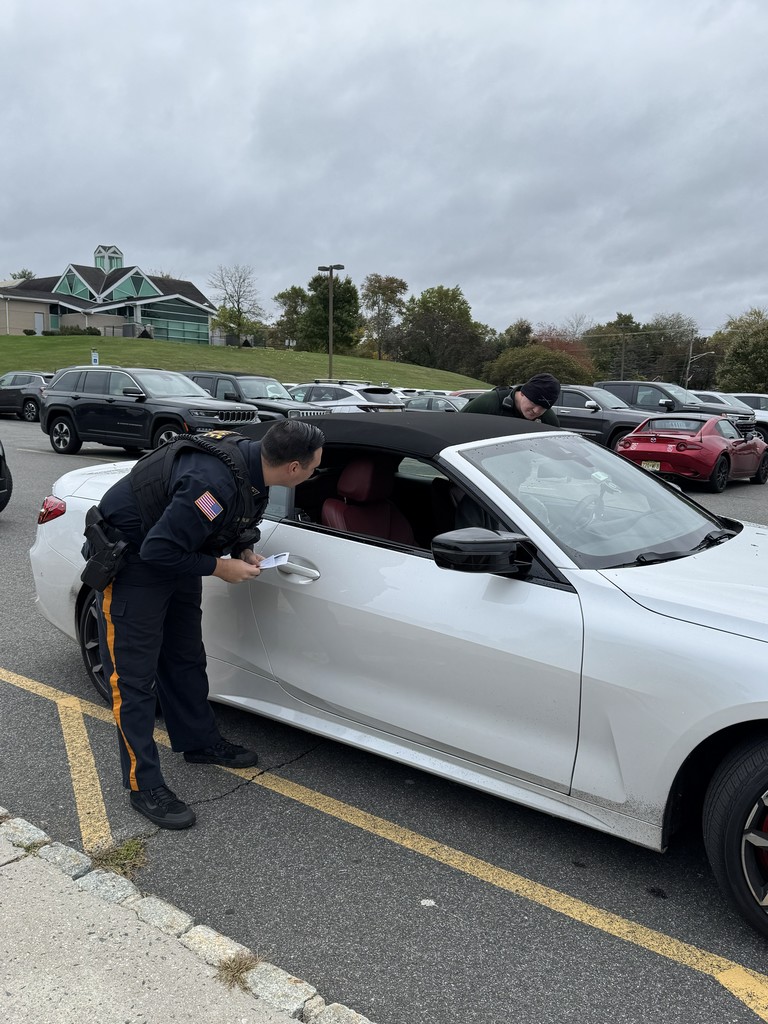 Officer Palma and Detective Johnson model traffic-stops for students in the Criminology classes.