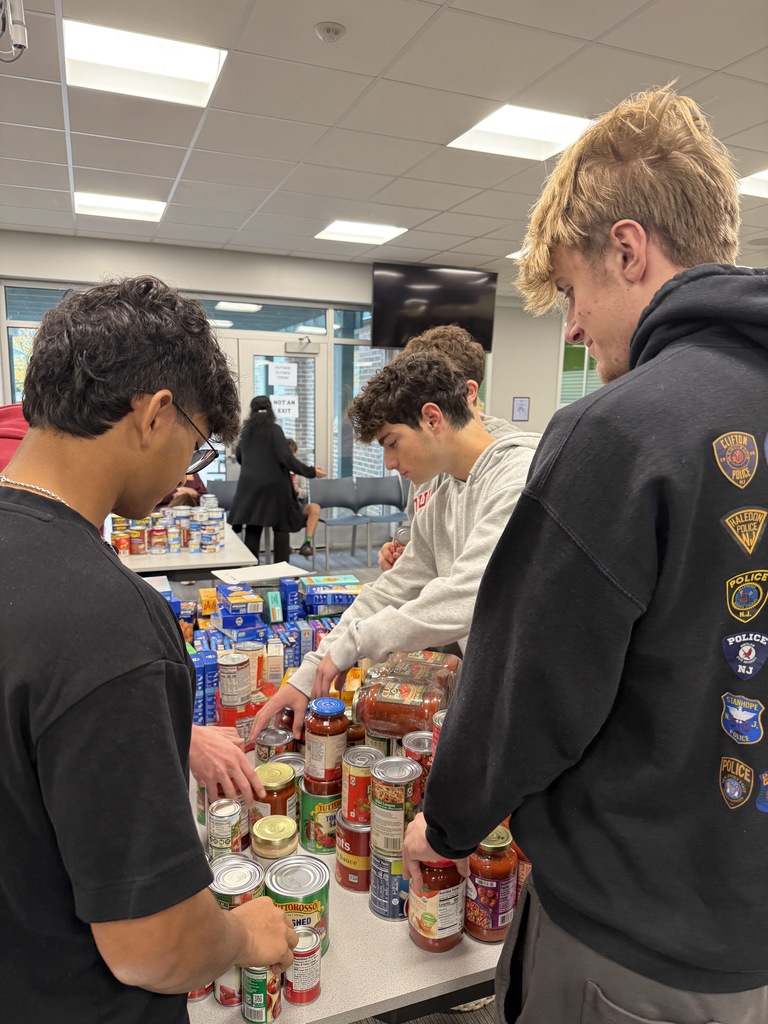 Students sorting items for the Key Club food drive.