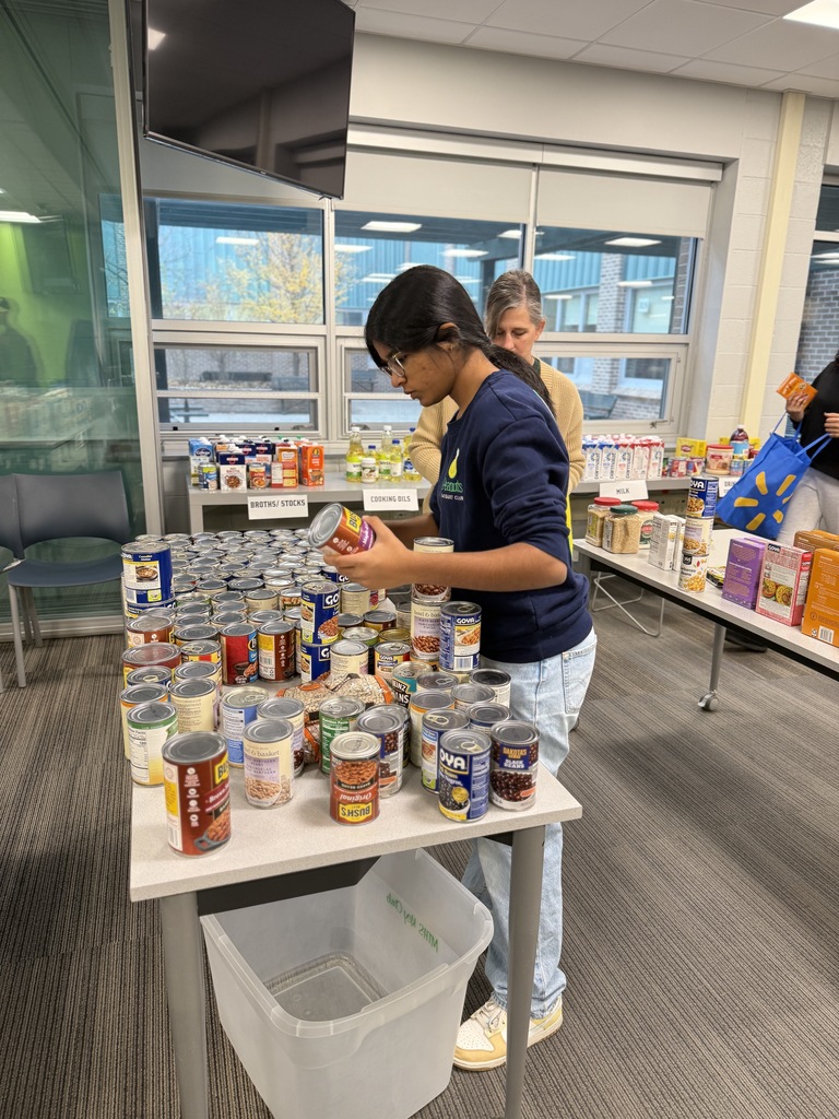 Students sorting items for the Key Club Food Drive