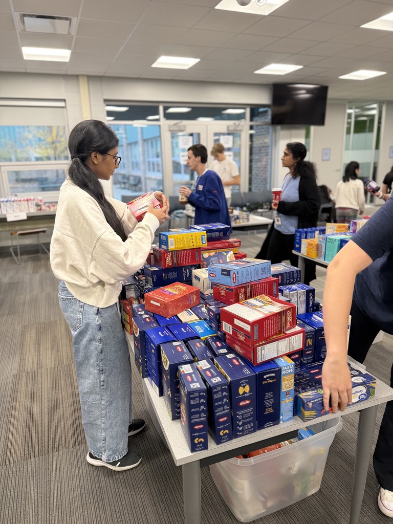 STudents sorting items for the Key Club food drive.