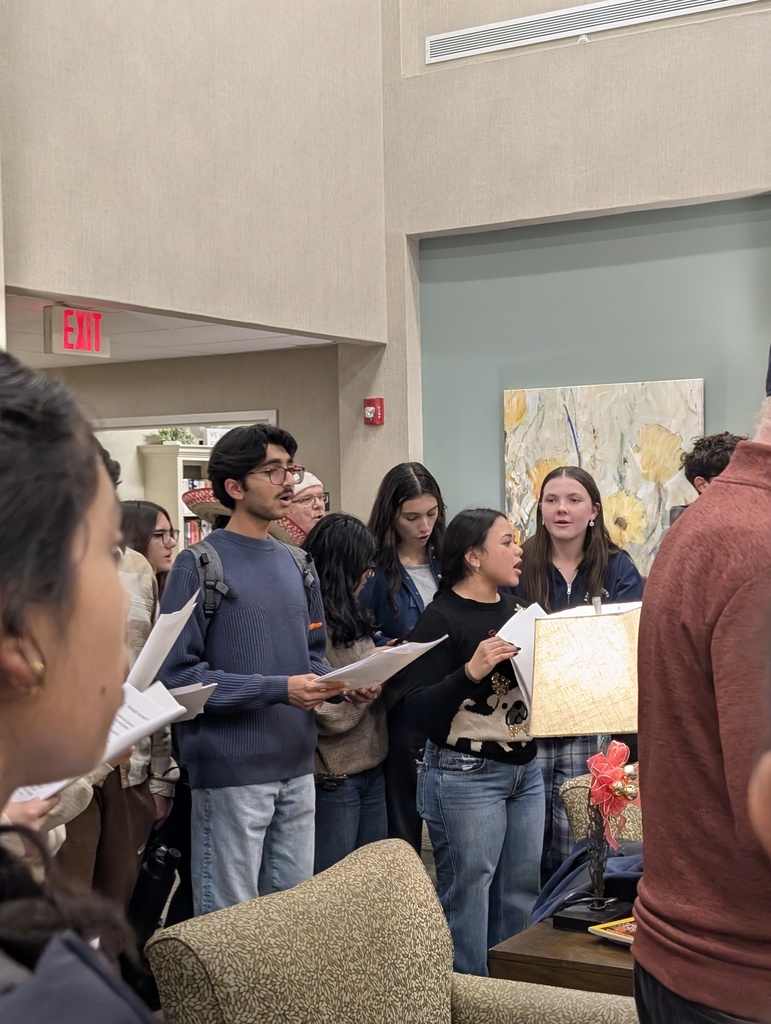 Members of the high school Key Club caroling at Mira Vie