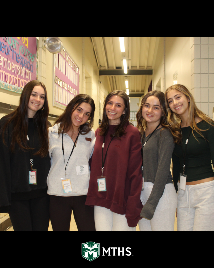 Twelfth grade students travel back to their elementary schools to celebrate Read Across America