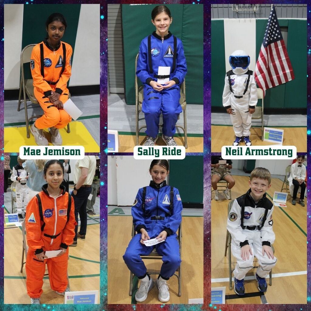 Children dressed as astronauts sit on chairs in a gym, labeled as Mae Jemison, Sally Ride, and Neil Armstrong. They wear colorful space-themed suits.
