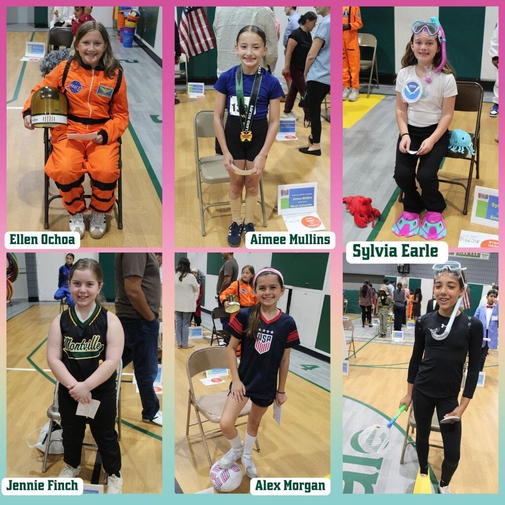 Six children dressed as notable women in various professions. Each stands beside a labeled chair in a gym, smiling proudly. Bright, lively atmosphere.