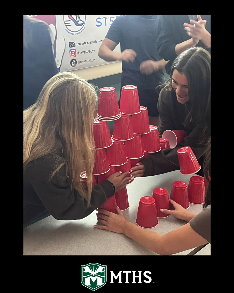 Students in Mr. Connolly's class use Solo cups to compete in the Reverse Pyramid activity to build teamwork.