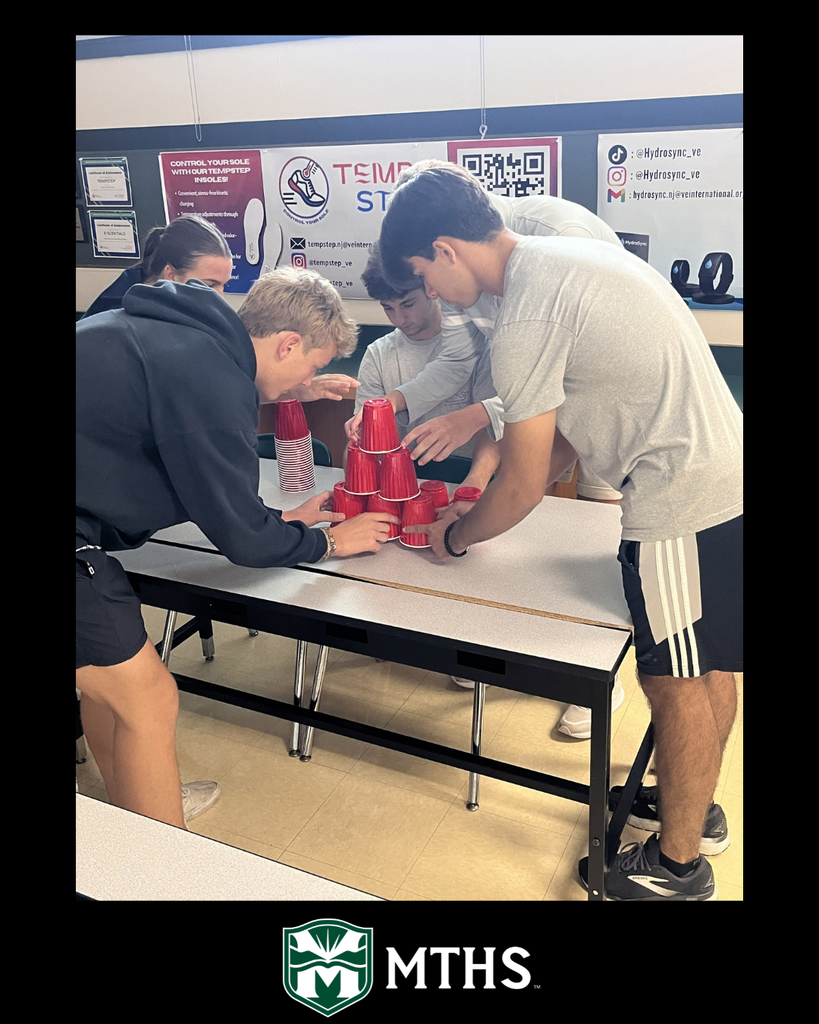 Students in Mr. Connolly's class use Solo cups to compete in the Reverse Pyramid activity to build teamwork.