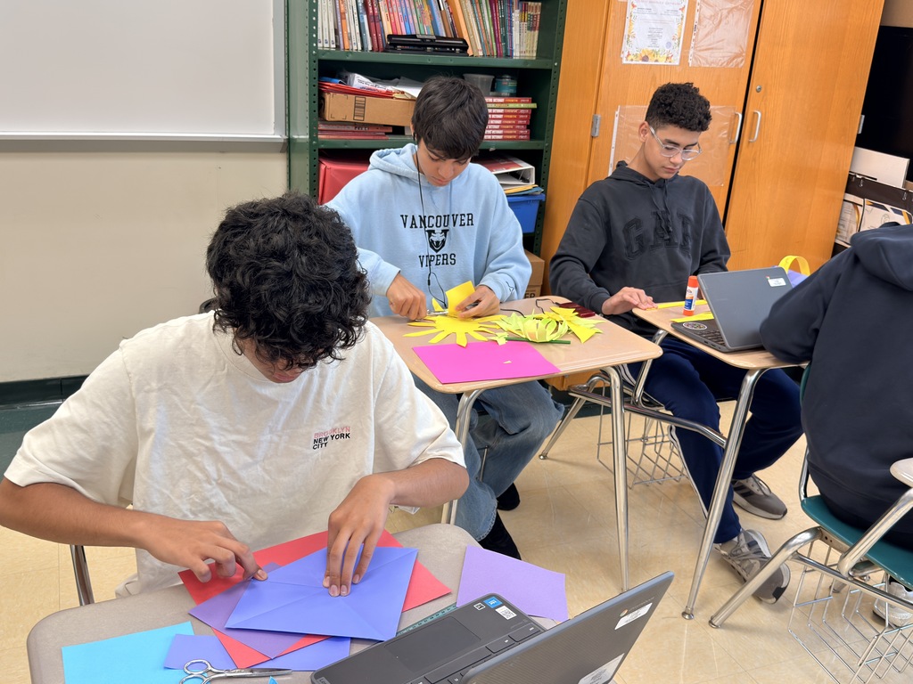 Students work on their lanterns for Mid-Autumn Festival