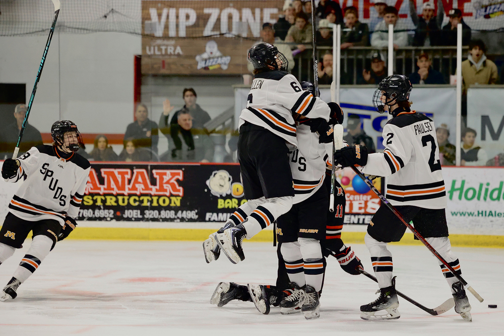 Spud hockey players celebrating
