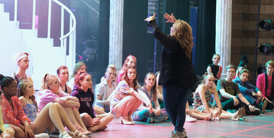 Rebecca Meyer-Larson instructing the cast of the MHS fall musical