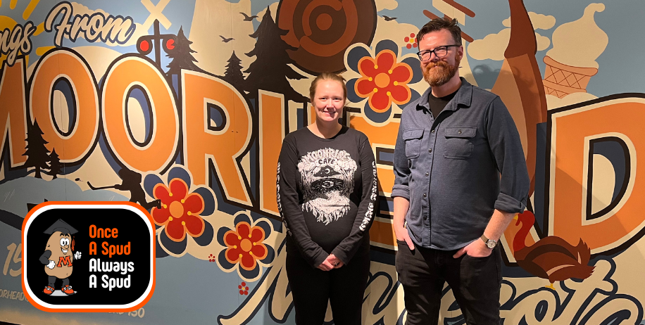 Once a Spud, Always a Spud: MHS 2013 and 2000 alums Petra Gunderson-Leith and Markus Krueger pose near a mural at the Hjemkomst Center