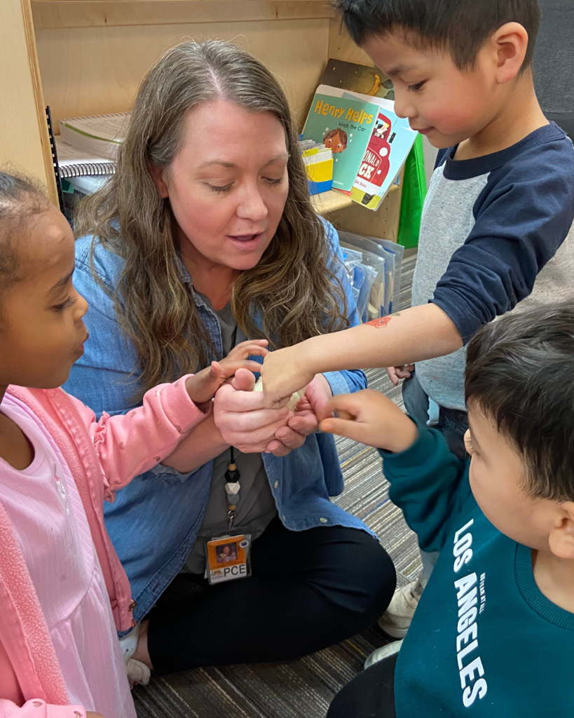 Shannon Knutson and Candace Havey's preschool class holding chicks.