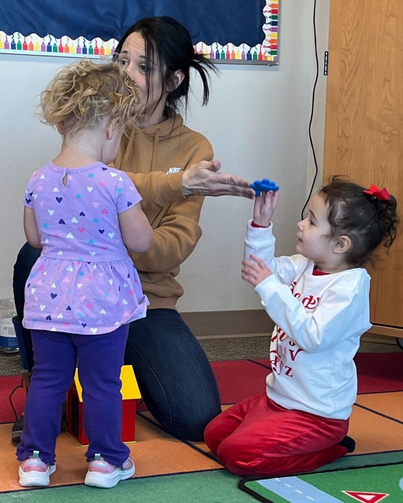 Ms. Shanna guiding students through the Ruff's House activity.