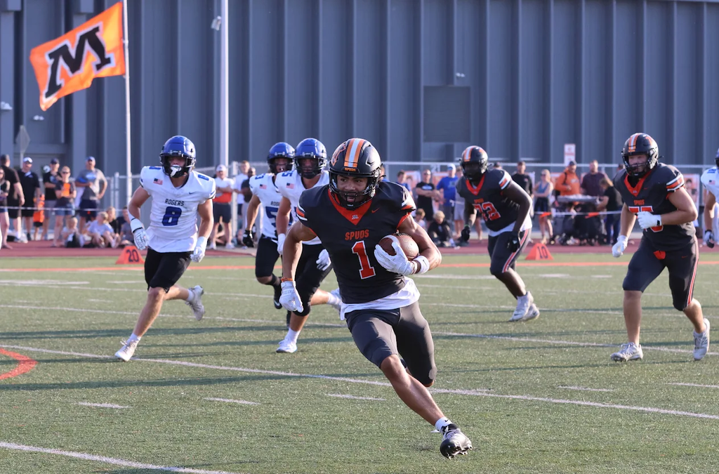 Junior Moorhead  Football Player #1 David Mack running with the football at the August 28th Football game in Jim Gotta Stadium.