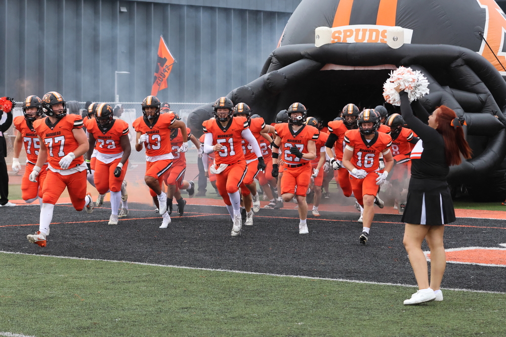MHS football team running out at homecoming game
