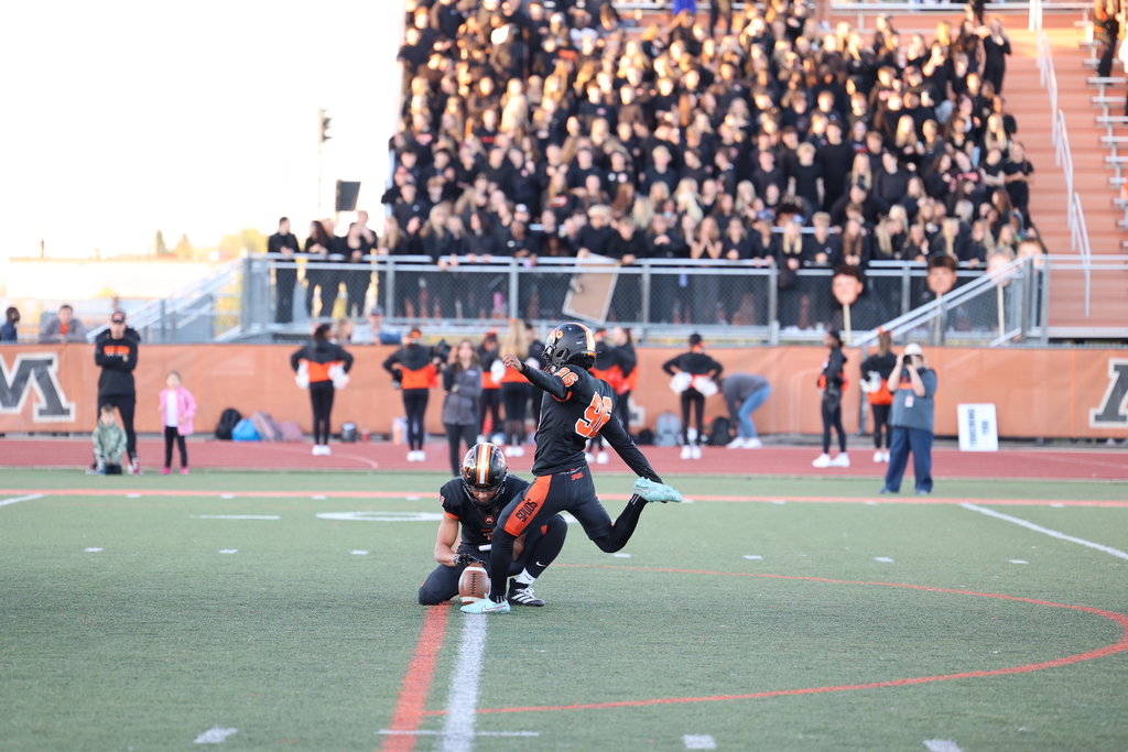 Kicker #96 for Moorhead Football kicking field goal
