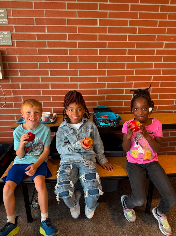 Kids enjoying apples at the great apple crunch