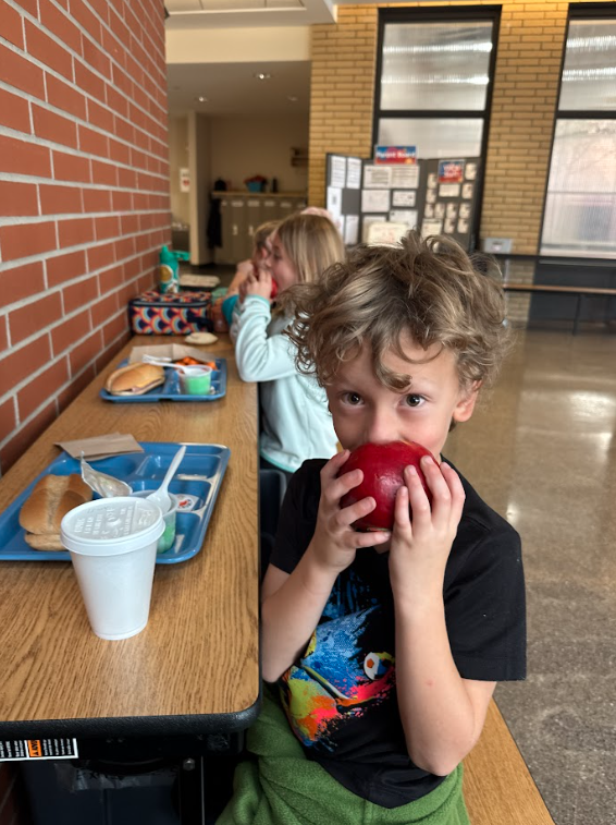 Kids enjoying apples at the great apple crunch