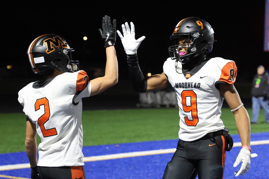 #2 and #9 high five, celebrating