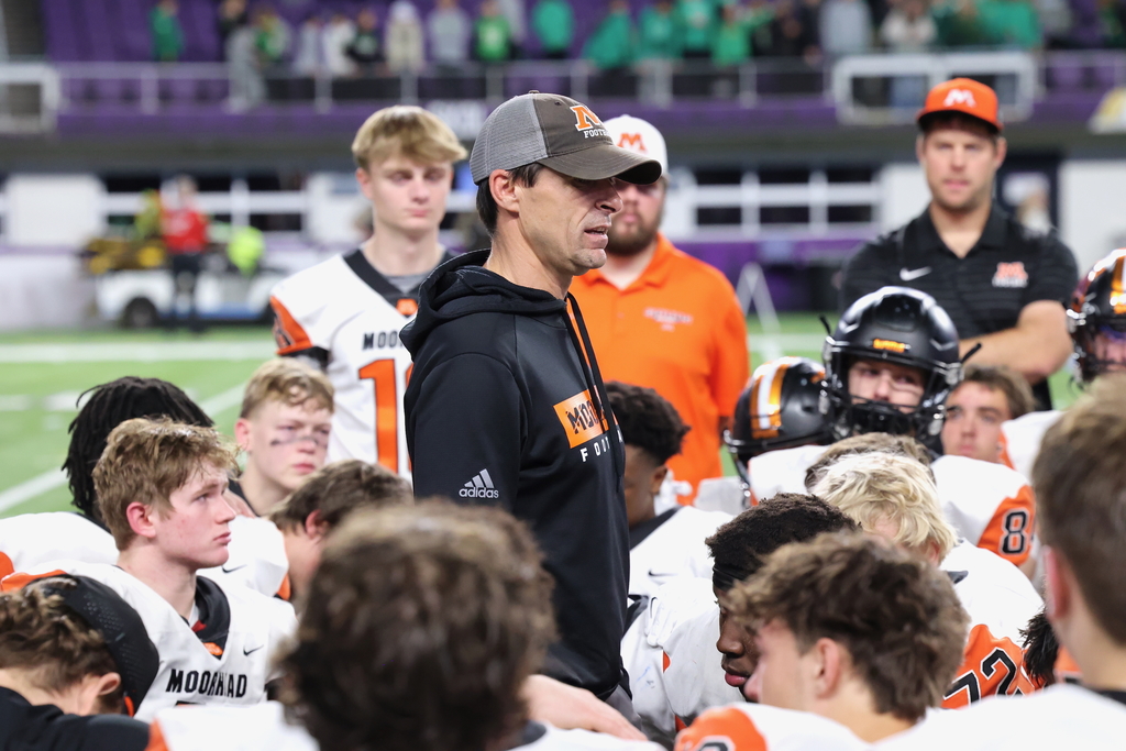 Coach feeney talking to the team