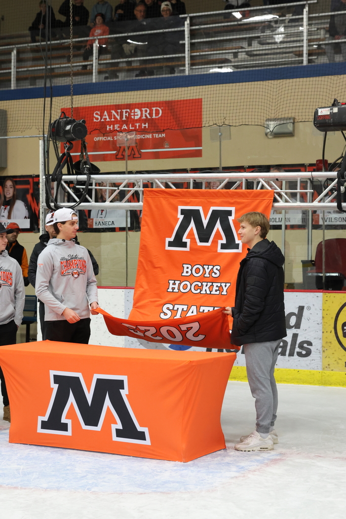 Putting up the Hockey State Banner