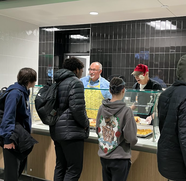 Rob Kupec at MHS serving food