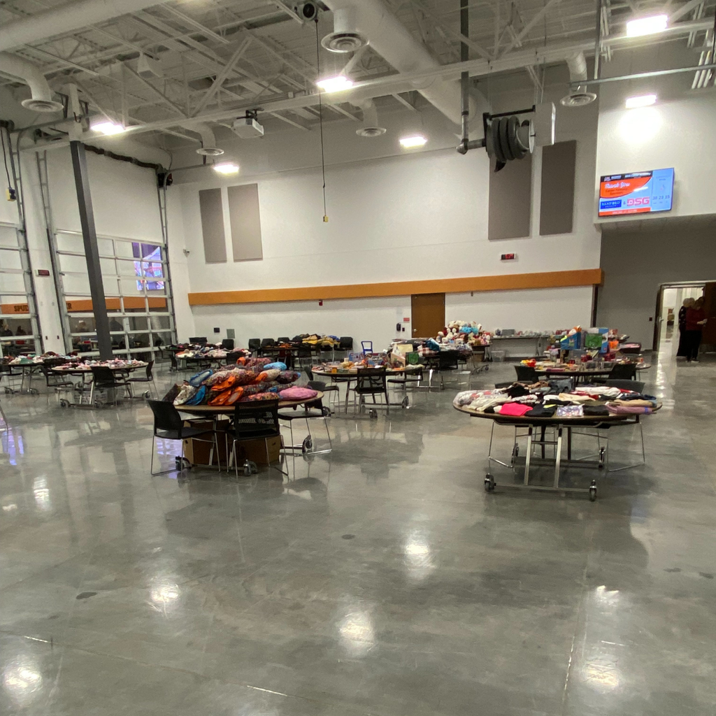 Tables of winter donations at the Career Academy Spud Locker