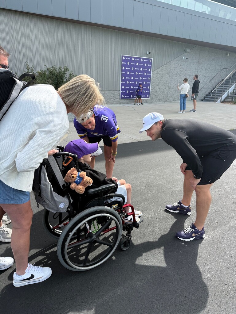 Student meeting coach after practice