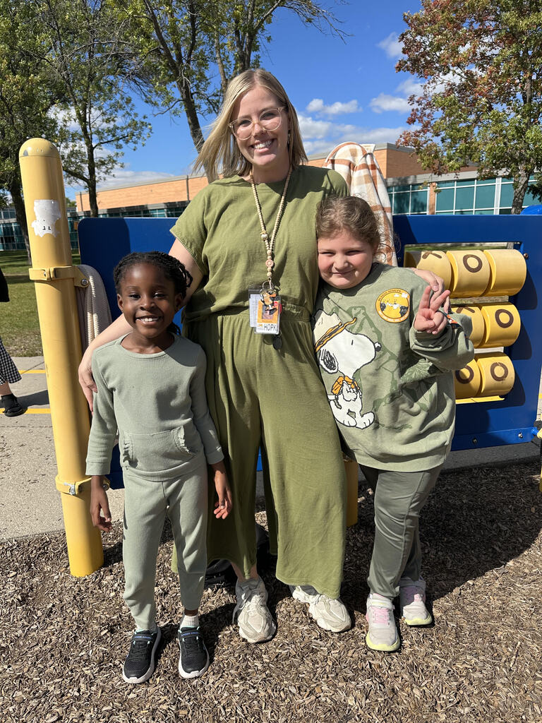 teacher wearing matching green with students