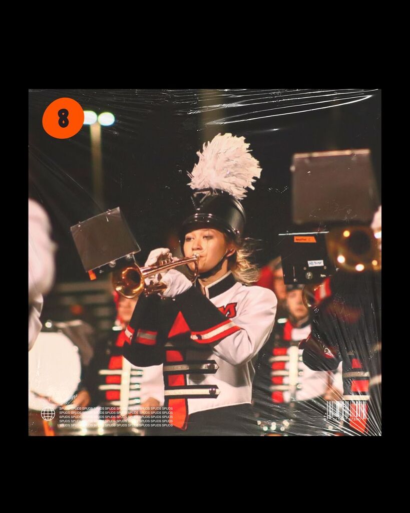 A graphic styled as a music cover featuring a marching band member playing a trumpet under stadium lights. An orange circle with the number 8 is positioned in the top-left corner.